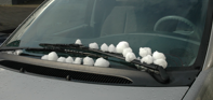 Balls of hail on the car windshield!